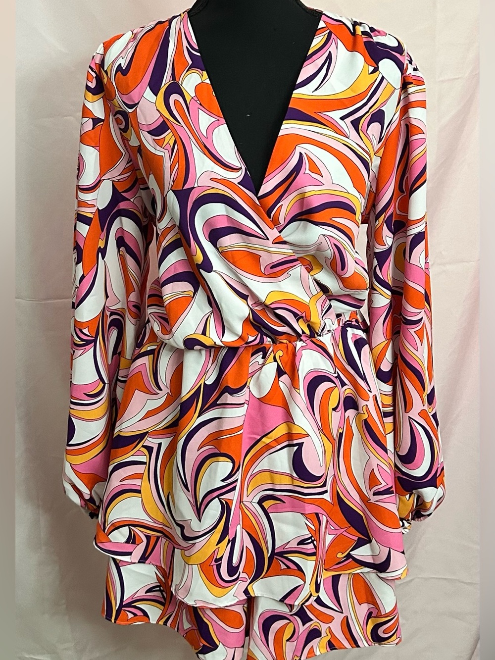 Express Retro Swirl Long-Sleeve Wrap Romper in Pink & Orange.